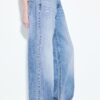 Calças de ganga de cintura baixa e perna Wide Leg com botão decorativo Calças de ganga de cintura baixa e perna Wide Leg com botão decorativo