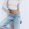 Calças de ganga de cintura baixa e perna Wide Leg com detalhe de estrela Calças de ganga de cintura baixa e perna Wide Leg com detalhe de estrela