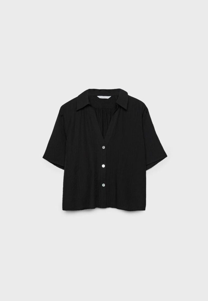 Camisa esvoaçante com botões Camisa esvoaçante com botões