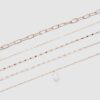 Conjunto de 5 colares com pingentes de pedras cor-de-rosa