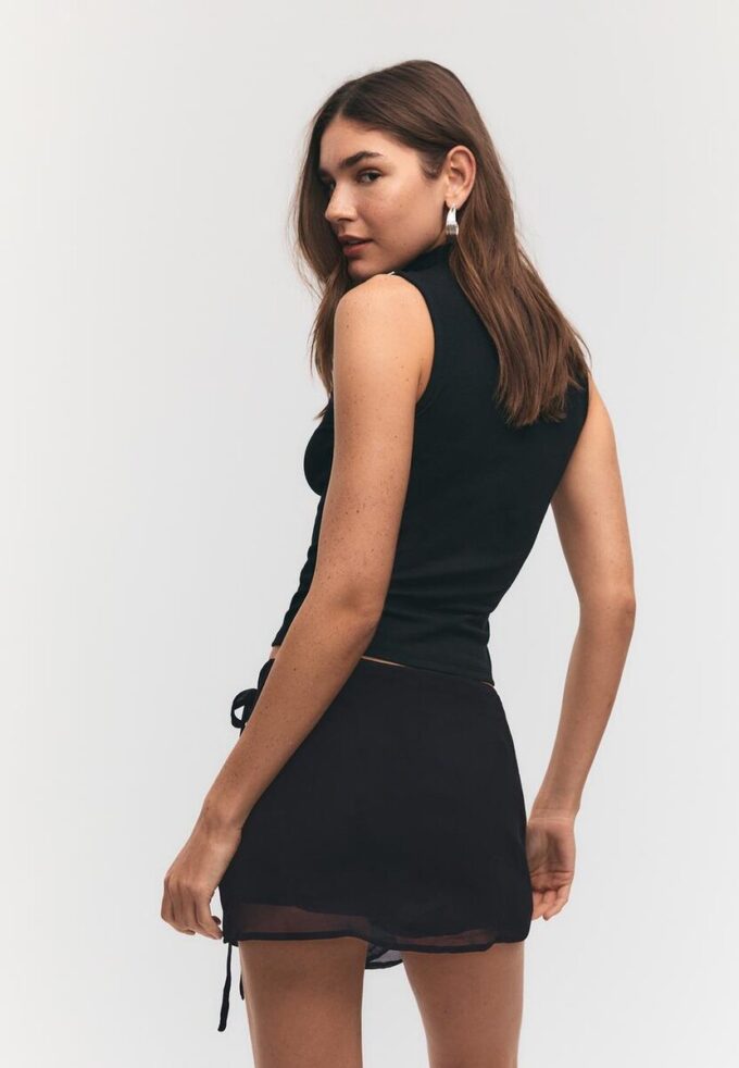 Mini-Skort com laço bordado Mini-Skort com laço bordado