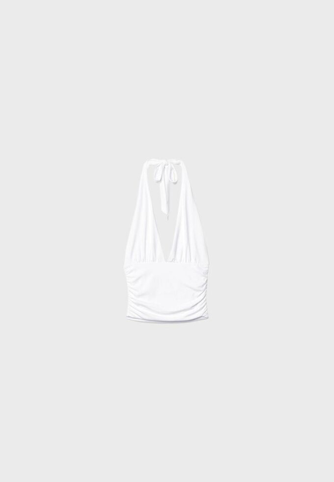 Tops com decote halter e laço franzido Tops com decote halter e laço franzido